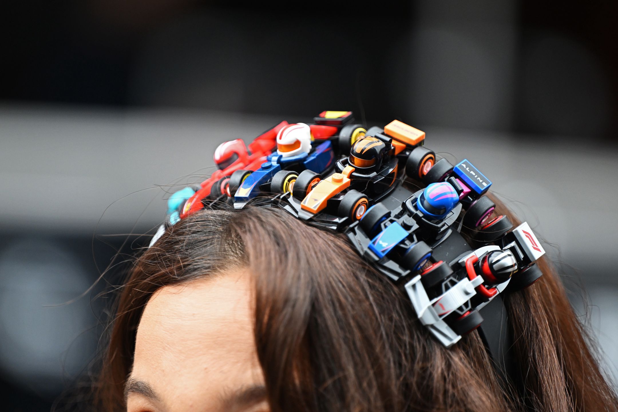 SPA, BELGIUM - JULY 27: A fan wears a headband made of LEGO F1 cars prior to the F1 Grand Prix of Belgium at Circuit de Spa-Francorchamps on July 27, 2025 in Spa, Belgium. (Photo by Mark Sutton - Formula 1/Formula 1 via Getty Images)