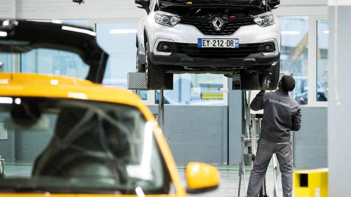 A technician works on a used vehicle at Renault SA's Re-Factory plant in Flins, France, on Tuesday, Nov. 30, 2021. The factory west of Paris, which makes the Zoe electric vehicle and the Nissan Micra, will transform by 2024 to recycle and retrofit cars and batteries. Photographer: Benjamin Girette/Bloomberg via Getty Images