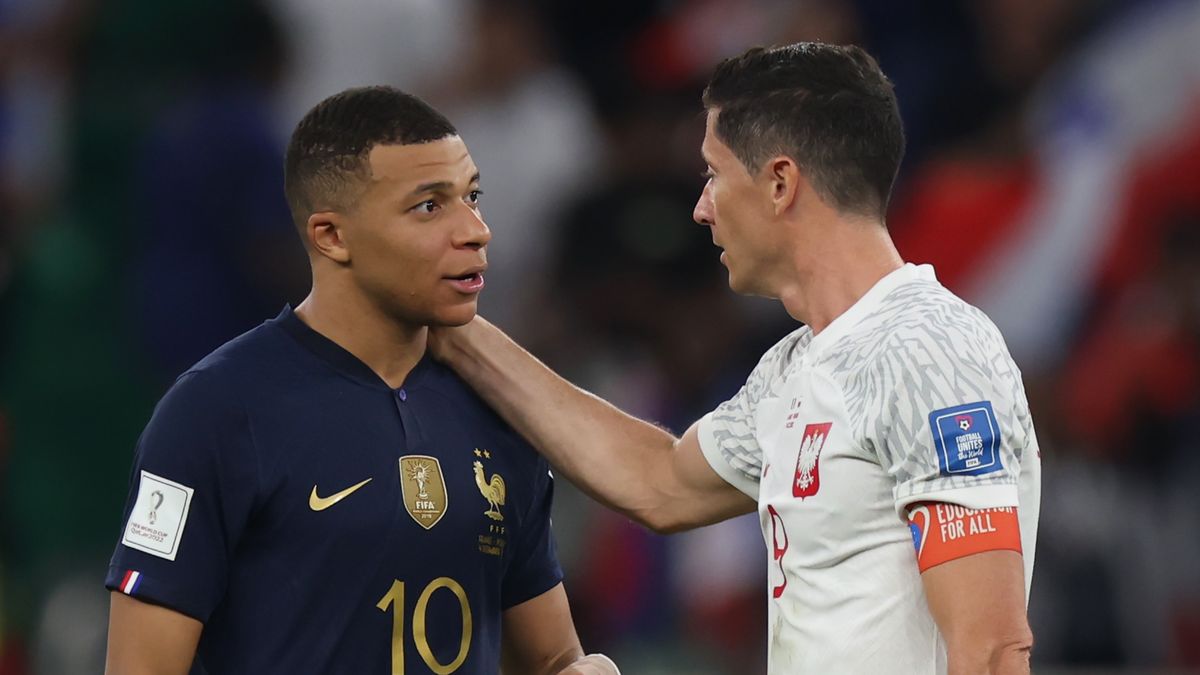 DOHA, QATAR - DECEMBER 04: Robert Lewandowski of Poland embraces Kylian Mbappe of France after the FIFA World Cup Qatar 2022 Round of 16 match between France and Poland at Al Thumama Stadium on December 04, 2022 in Doha, Qatar. (Photo by Alex Grimm/Getty Images)