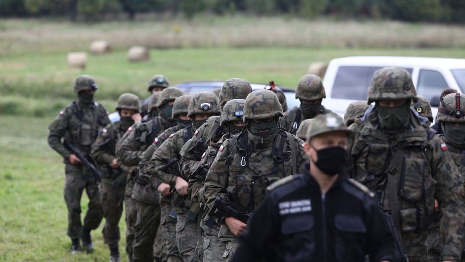 Polish Border Guards In Stand-off With Belarusian Counterparts Over Refugees At Border
Armed members of the Polish Border Guards are seen arriving near the border with Belarus on 20 August, 2021 in Usnarz Gorny, Poland. Around 32 Afghan citizens are being held in place on the border by Polish border guards and Belarusian forces. The refugees are now pawns in a game between Lukashenko's regime who is expelling them forcefully over the border in retlation for EU sanctions and the Polish government which says it will protect Poland from illegal migrants.In the last weeks Belarusian authorities have been pushing an increasing number of refugees, mainly from Iraq over the borders of Poland, Lithuania and Latvia. (Photo by STR/NurPhoto via Getty Images)
NurPhoto
arms, border, border guard, force, fsb, migrant, migration, nationalism, police, refugees, last weeks belarusian authorities, polish border guards, belarusian forces, polish government, armed members, usnarz gorny, 32 afghan citizens, eu sanctions, illegal migrants, increasing number, 20 august, around, place, game, lukashenko, regime, retlation, borders, photo