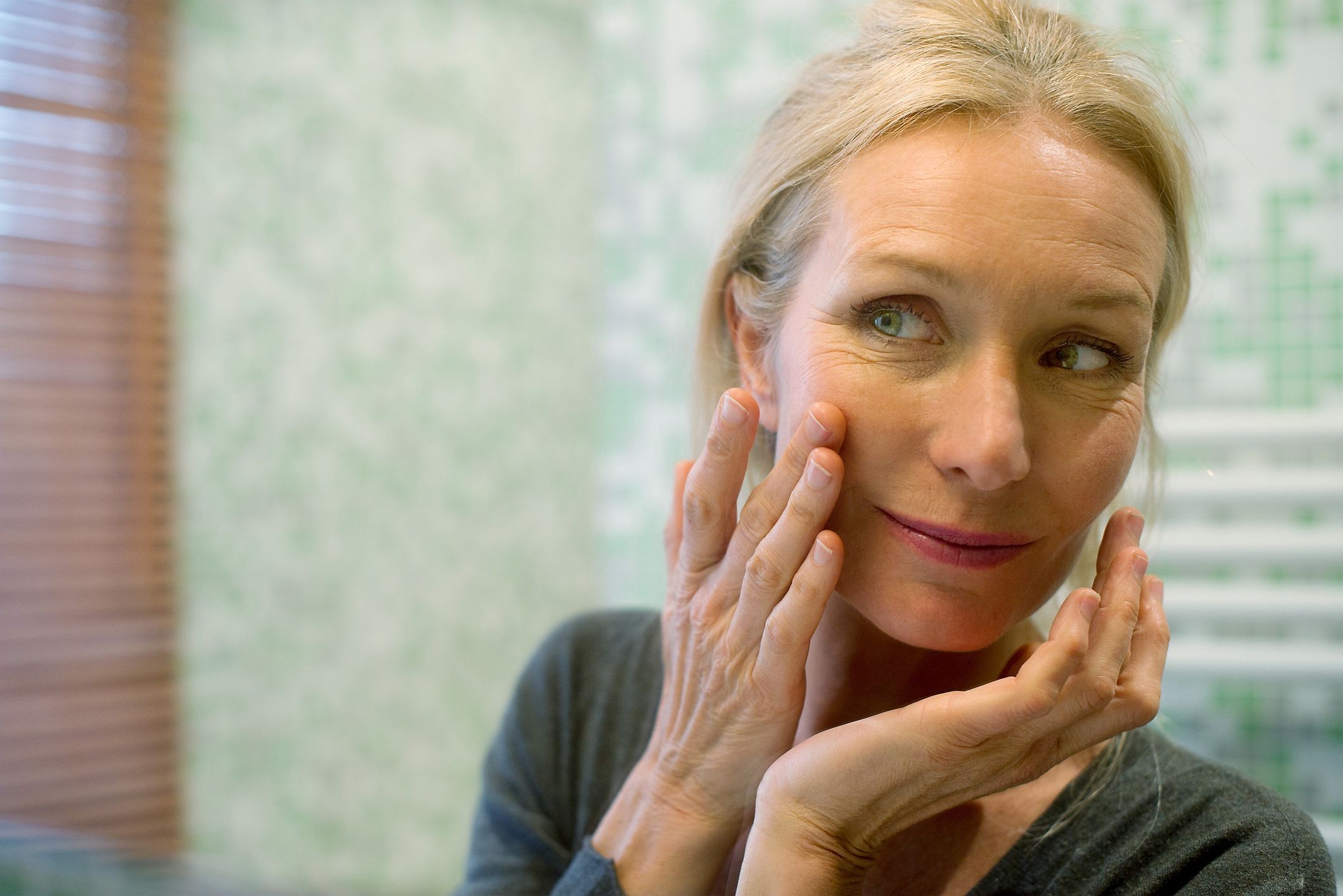Mature woman looking at reflection in mirror with hand on cheek
PhotoAlto/Frederic Cirou
anti-aging, beauty care, blonde, daily life, face, head and shoulders, mature woman, maturity, moisturizing, paris, positive, woman
