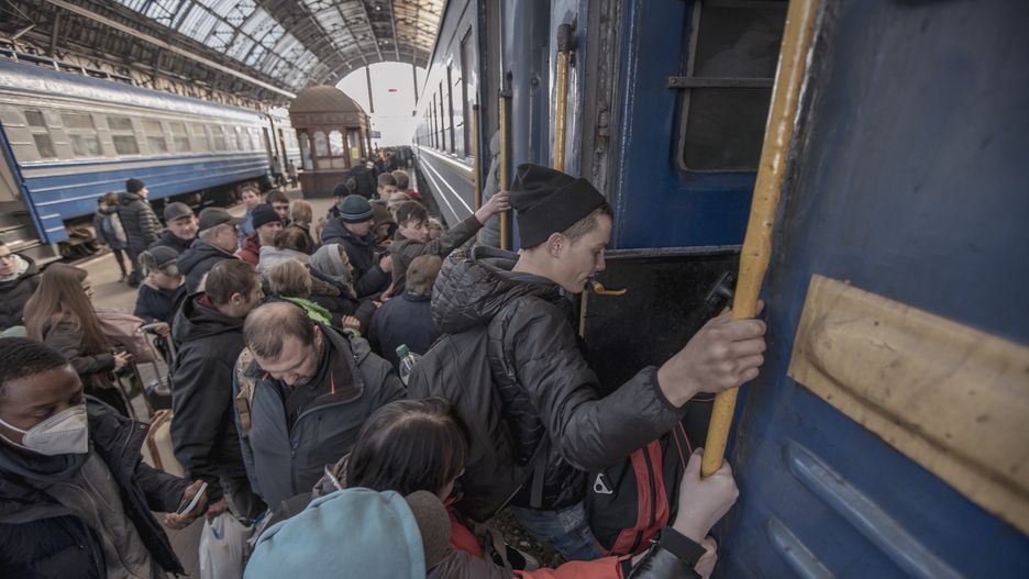 People rush to get on the train and push each other while they are boarding as they are scared of possible bombing. Ukrainian people, mostly women, mothers with children or elderly, the war refugees as seen boarding the train railroad car, they get in fast after waiting underground at Lviv railway station passageway the train to arrive and board on the carriages quickly as the station is considered as a military target. The train is going to cross the Polish Ukrainian borders and travel further to Poland and other European Countries. On March 15 the sirens for air raid sounded two times, one in the morning and one in the evening. According to UN - UNHCR more than 3.3 million refugees left the country as United Nations announced and showed the data on a map while almost 6.5 million Ukrainians have been internally displaced since the Russian military invasion.  Lviv, Ukraine on March 15, 2022 (Photo by Nicolas Economou/NurPhoto via Getty Images)
