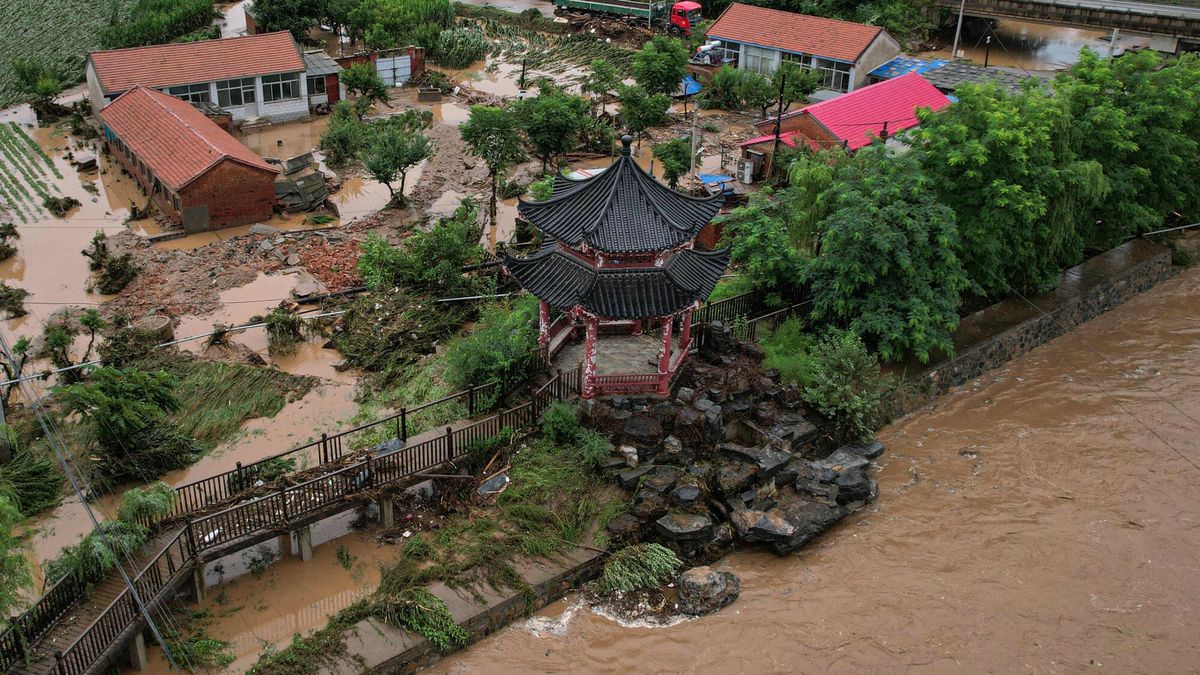 Temporary
TOPSHOT - An aerial view shows damaged buildings after heavy rains at Xin'anzhuang village, in Miyun district, on the outskirts of Beijing on July 28, 2025. A landslide triggered by unusually heavy rain killed four people and left eight others missing in northern China's Hebei province, state media said on July 28, as downpours force thousands to evacuate. (Photo by Jade GAO / AFP)
JADE GAO