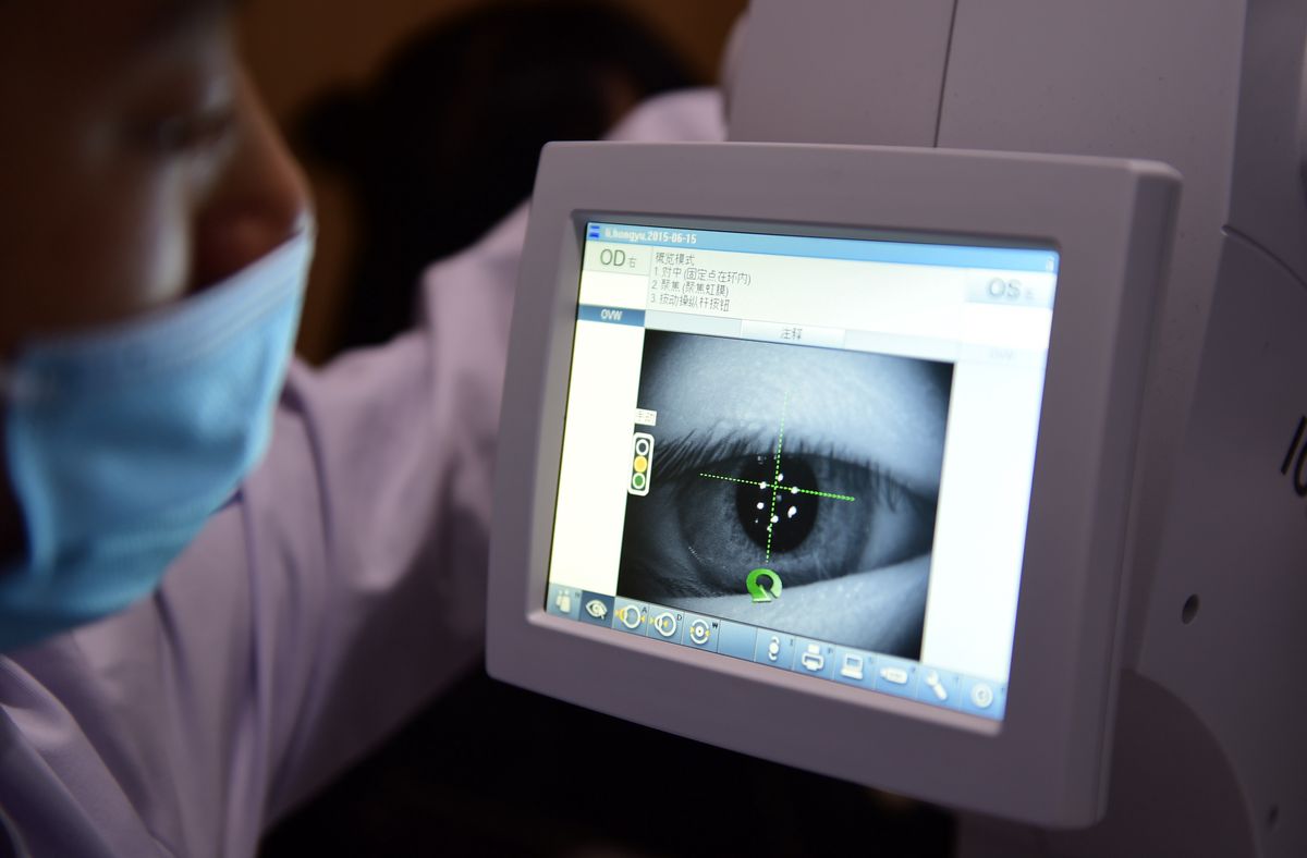 HEFEI, CHINA - DECEMBER 16, 2021 - An ophthalmologist checks the eyesight of a student at the Provincial Medical Eye optometry Center in Hefei, East China's Anhui province, Dec. 16, 2021. (Photo credit should read Ge Chuanhong / Costfoto/Future Publishing via Getty Images)