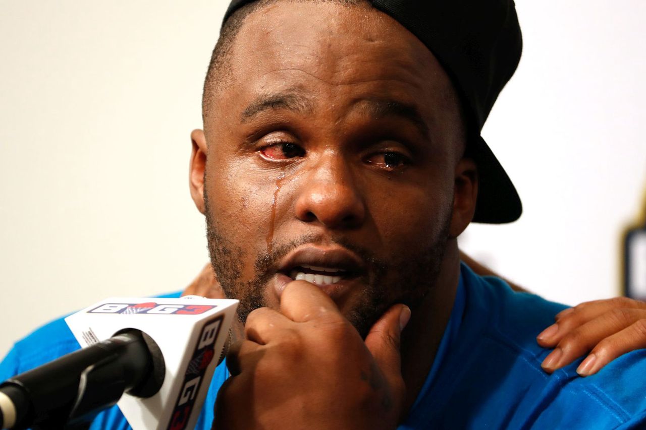 Glan Davis in tears during a press conference.