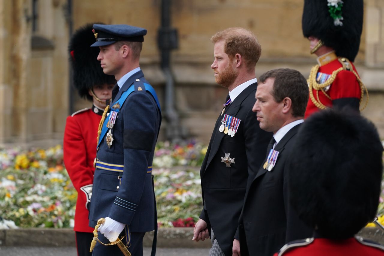 WINDSOR, ENGLAND - SEPTEMBER 19: Prince William, Prince of Wales, Prince Harry the Duke of Sussex and Peter Phillips arriving for Committal Service at St George's Chapel, Windsor Castle on September 19, 2022 in Windsor, England. The committal service at St George's Chapel, Windsor Castle, took place following the state funeral at Westminster Abbey. A private burial in The King George VI Memorial Chapel followed. Queen Elizabeth II died at Balmoral Castle in Scotland on September 8, 2022, and is succeeded by her eldest son, King Charles III. (Photo by Owen Humphreys - WPA Pool/Getty Images)