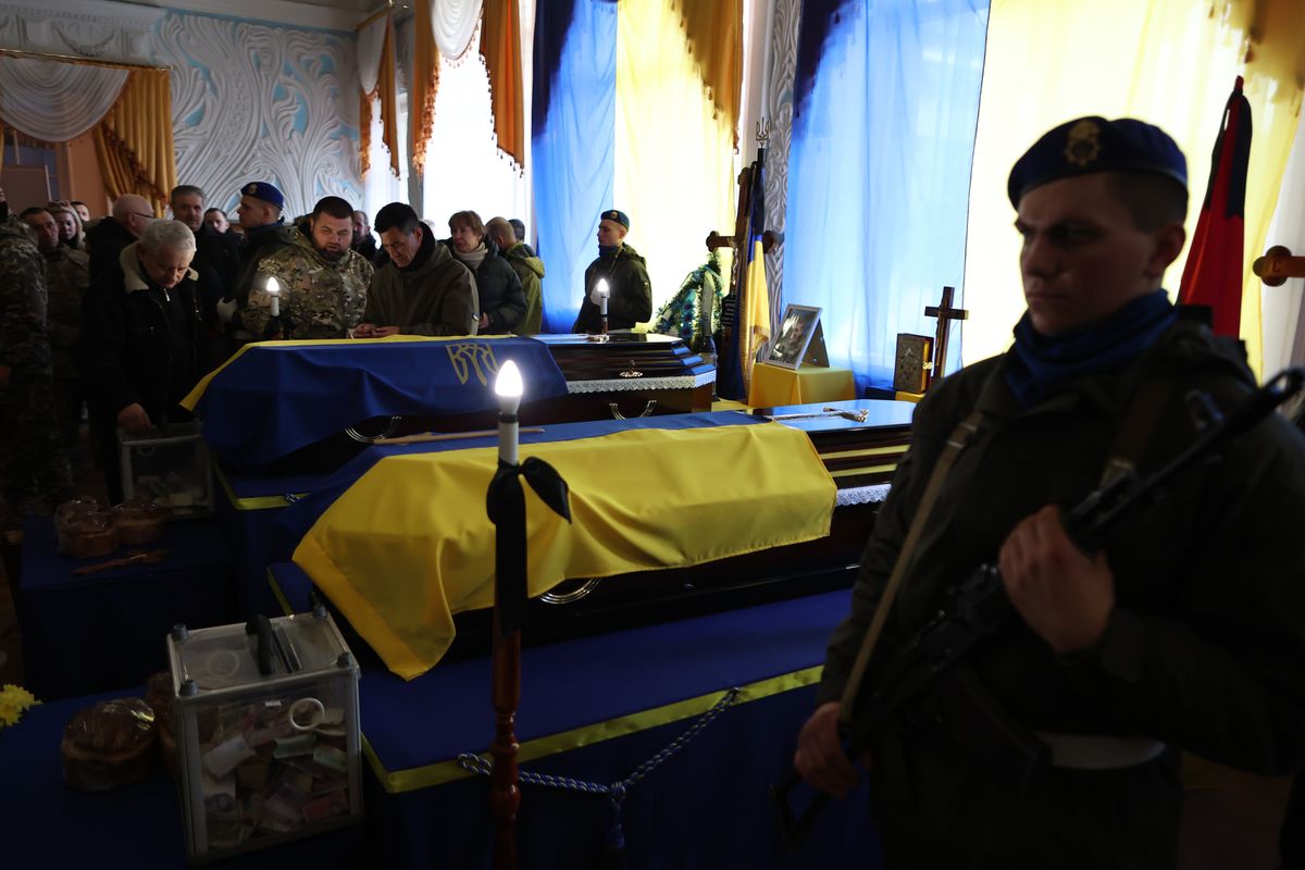 IVANO-FANKIVSK REGOIN, UKRAINE - APRIL 04, 2022 - Coffins are seen during a funeral ceremony for Ukrainian defenders, brothers Roman and Leonid Butusin, town of Kalush, Ivano-Frankivsk Region, western Ukraine (Photo by Yurii Rylchuk/Ukrinform/NurPhoto via Getty Images)