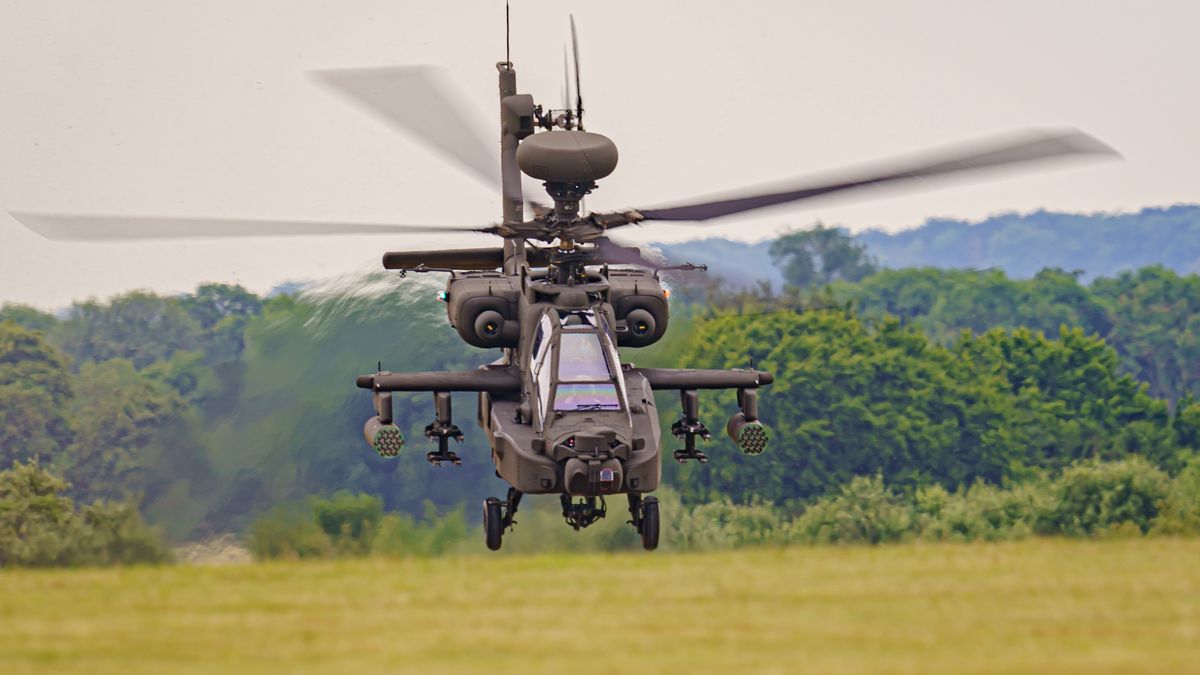 The Army Air Corps latest Apache AH-64E attack helicopter performs maneuvers over open countryside at the Army Aviation Centre at Middle Wallop, Stockbridge in Hampshire. Picture date: Tuesday July 12, 2022. (Photo by Ben Birchall/PA Images via Getty Images)
