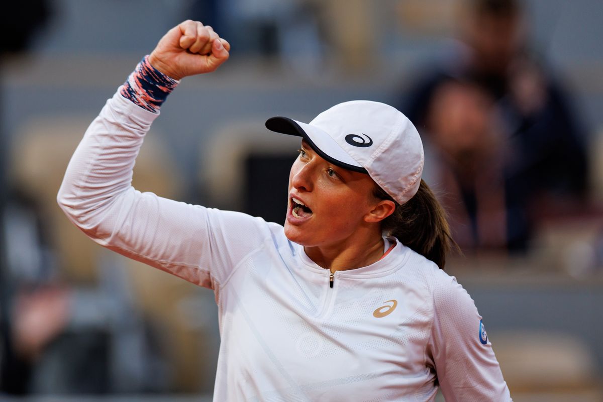 PARIS, FRANCE - MAY 30: Iga Swiatek of Poland celebrates her victory over Qinwen Zheng of China in the fourth round of the a women's singles at Roland Garros on May 30, 2022 in Paris, France. (Photo by TPN/Getty Images)