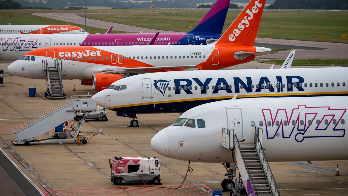 Passenger aircraft, operated by EasyJet Plc, Wizz Air Holdings Plc and Ryanair Holdings Plc, on the tarmac at London Luton Airport Ltd. in Luton, U.K., on Thursday, Sept. 9, 2021. EasyJet rejected an unsolicited takeover approach from rival discounter Wizz Air, according to people familiar with the matter, and said it will raise $2 billion in stock and debt instead. Photographer: Chris J. Ratcliffe/Bloomberg via Getty Images