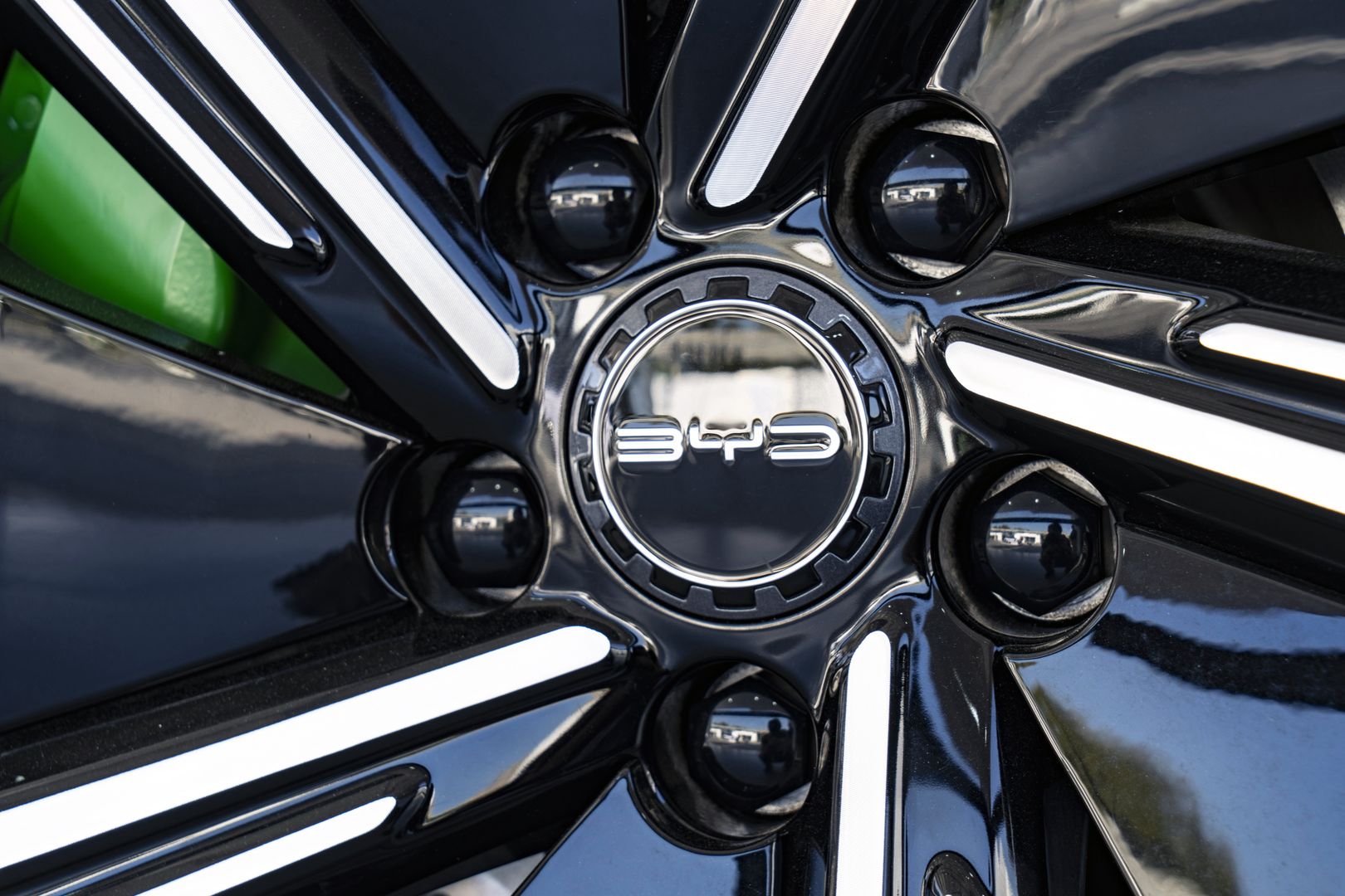 Signage for BYD Co. on a wheel hub of an electric vehicle at the company's headquarters in Shenzhen, China, on Monday, Jan. 15, 2024. BYD, the world's largest maker of electric vehicles, will invest 100 billion yuan ($14 billion) to develop smart-car features, its founder and chief executive officer said Tuesday. Photographer: Qilai Shen/Bloomberg via Getty Images