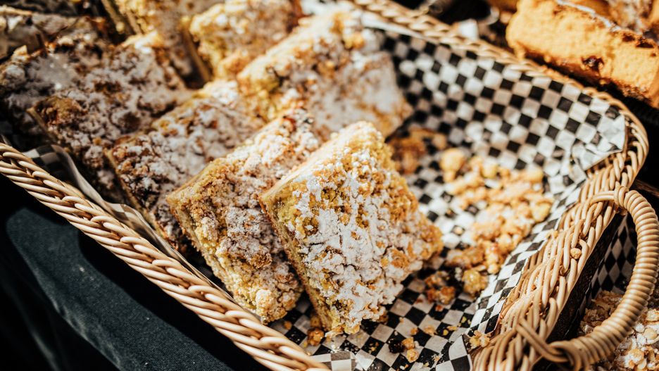 An assortment of pastries, muffins, and baked goods displayed in baskets and trays at an outdoor market stall, sprinkled with sugar and nuts for a rustic treat
almond, artisanal, assortment, baked delights, baked goods, bakery, bakery stand, basket, bread rolls, cakes, checkered paper, chocolate, confectionery, crunchy, crust, delicious, desserts, display, event, fair, food fair, food stall, fresh, golden, hand, handmade, homemade, icing, indulgence, market, muffins, nuts, outdoor, pastries, pastry shop, powdered sugar, rustic, sale, selection, serving, snack, soft, sponge cake, sugar dust, sweet, sweet tooth, tasty, tongs, tray, treats, variety, almond, artisanal, assortment, baked delights, baked goods, bakery, bakery stand, basket, bread rolls, cakes, checkered paper, chocolate, confectionery, crunchy, crust, delicious, desserts, display, event, fair, food fair, food stall, fresh, golden, hand, handmade, homemade, icing, indulgence, market, muffins, nuts, outdoor, pastries, pastry shop, powdered sugar, rustic, sale, selection, serving, snack, soft, sponge cake, sugar dust, sweet, sweet tooth, tasty, tongs, tray