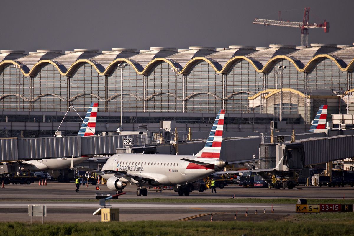 An American Airlines Group Inc. Embraer 175 plane taxis at Reagan National Airport (DCA) in Arlington, Virginia, U.S., on Monday, April 6, 2020. U.S. airlines are applying for federal aid to shore up their finances as passengers stay home amid the coronavirus pandemic. Photographer: Andrew Harrer/Bloomberg via Getty Images