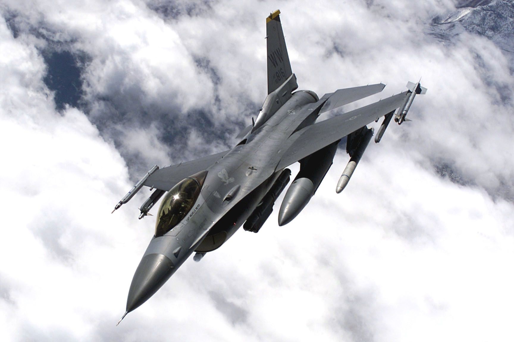 An F-16 from the 13th Fighter Squadron, Misawa AB Japan banks over Nellis AFB's expansive range. The aircraft is a participant of Red Flag 01-03.