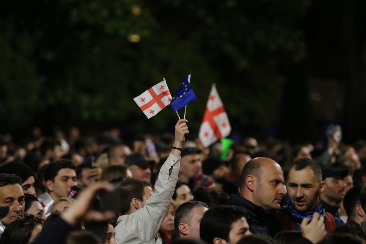 TBILISI, GEORGIA - MAY 15: People hold flags as they attend the ongoing protest against 'transparency of foreign influence' bill after government's approval in Tbilisi, Georgia on May 15, 2024.  (Photo by Davit Kachkachishvili/Anadolu via Getty Images)