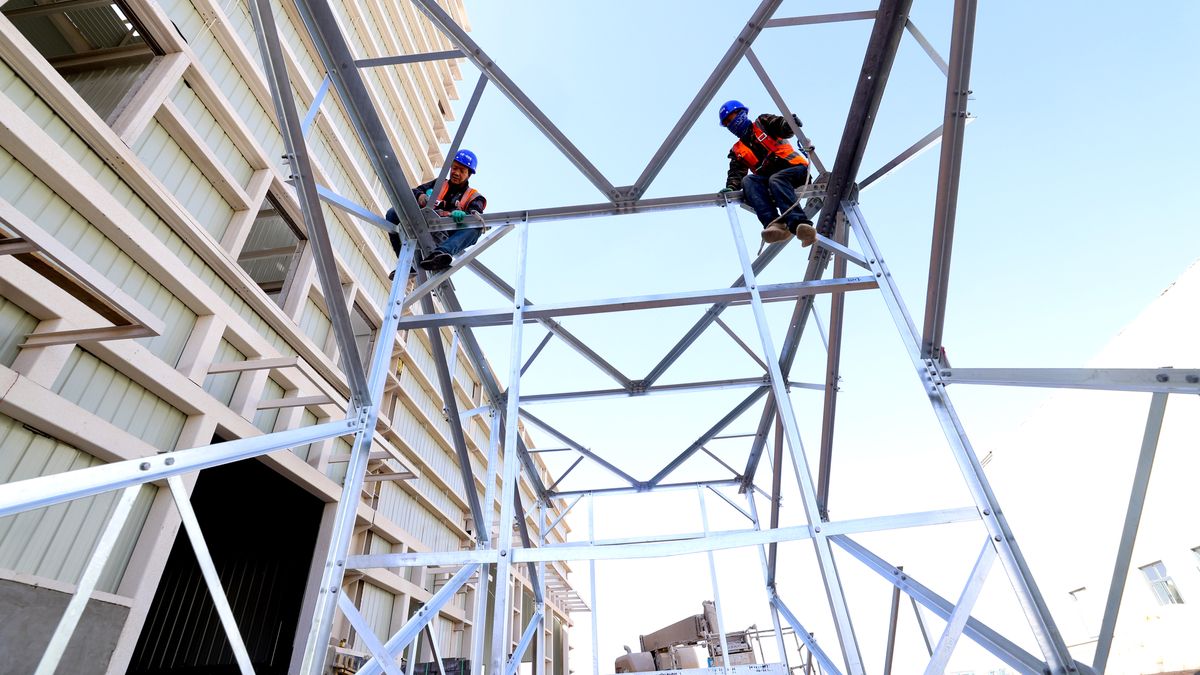 ZHANGYE, CHINA - APRIL 24, 2024 - Construction workers link a steel tower at the construction site of Zhangye Waste disposal and resource utilization Center in Zhangye city, Gansu province, China, April 24, 2024. (Photo credit should read CFOTO/Future Publishing via Getty Images)