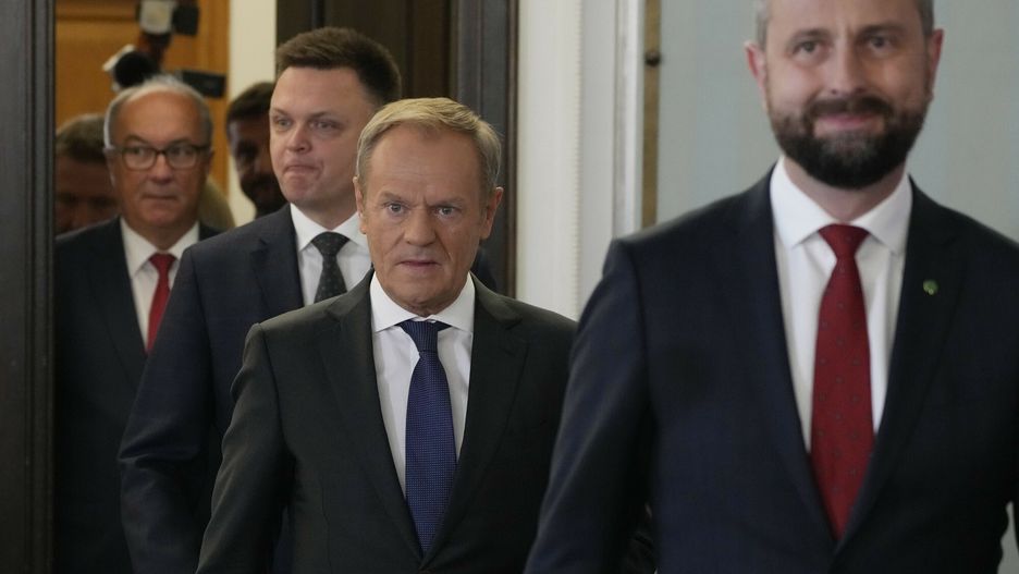 Konsultacje ws. nowego rz?du w Pa?acu Prezydenckim
Opposition party leaders, from left, Wlodzimierz Czarzasty, Szymon Holownia, Donald Tusk and W?adyslaw Kosiniak-Kamysz arrive for a meeting where announce to reporters that Tusk is their candidate for prime minister and that they are ready to govern together, in Warsaw, Poland, on Tuesday Oct. 24, 2023. The parties together won a majority of seats in parliament in an election on Oct. 15. The current conservative nationalist ruling party, Law and Justice, won more votes than any other party but has no coalition partner and no apparent path to keeping power. (AP Photo/Czarek Sokolowski)
Czarek Sokolowski