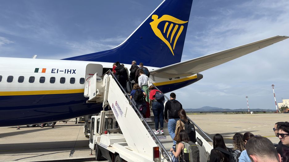 CAGLIARI, SARDINIA - MAY 03: (EDITORS NOTE: Image taken with a mobile phone) Passengers board a Ryanair Boeing 737 MAX 8-200 EI-IHX at Cagliari International Elmas Airport on May 03, 2025 in Cagliari, Italy. (Photo by John Keeble/Getty Images)
