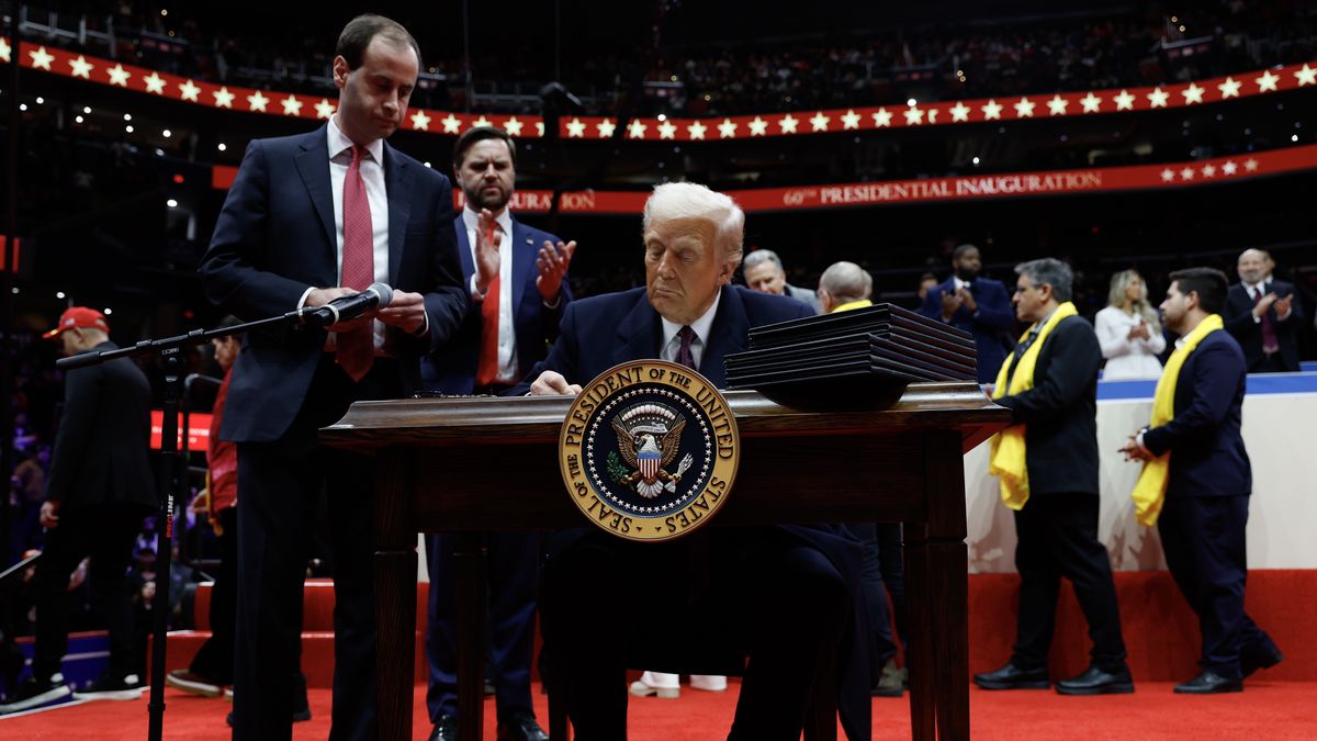 WASHINGTON, DC - JANUARY 20: U.S. President Donald Trump signs executive orders during an indoor inauguration parade at Capital One Arena on January 20, 2025 in Washington, DC. Donald Trump takes office for his second term as the 47th president of the United States. (Photo by Anna Moneymaker/Getty Images)