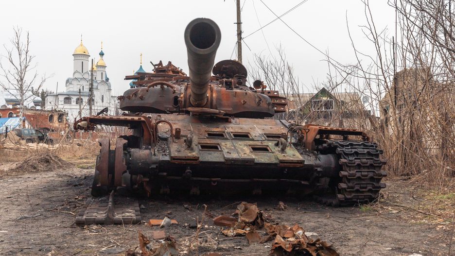 SVYATOGIRSK, DONETSK REGION, UKRAINE - 2024/02/13: A burnt-out Russian tank is seen on the street of Svyatogirsk against the background of churches Sviatohirsk is a town in the north of Donetsk Oblast, located on the banks of the Seversky Donets River. Sviatohirsk has been under occupation since 6 June 2022, and Ukrainian defenders entered the city on 9 September 2022. As a result of enemy shelling, many buildings in the city were destroyed. Local residents hide from Russian bombardment in churches and monasteries. (Photo by Mykhaylo Palinchak/SOPA Images/LightRocket via Getty Images)