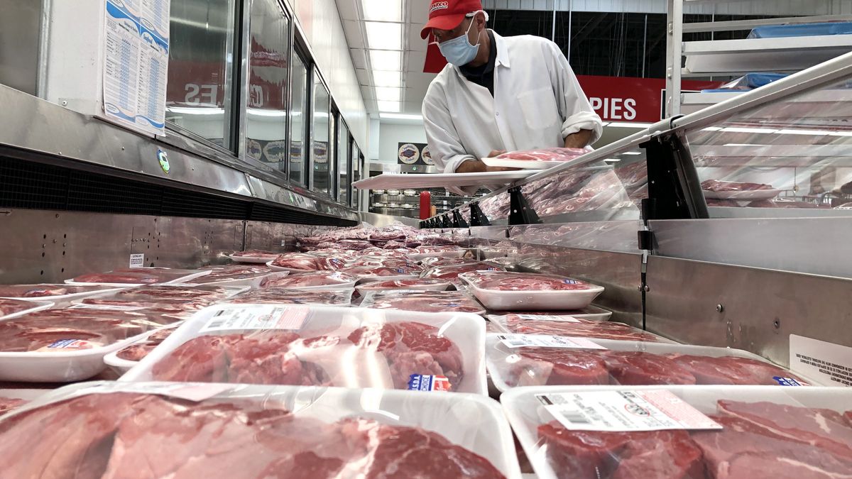 NOVATO, CALIFORNIA - MAY 24: A butcher stocks a display case with packages of steaks at a Costco store on May 24, 2021 in Novato, California. According to a Morning Consult survey of 2,200 adult shoppers, one-third of those surveyed say that they are paying more for groceries, especially red meat and chicken. (Photo by Justin Sullivan/Getty Images)