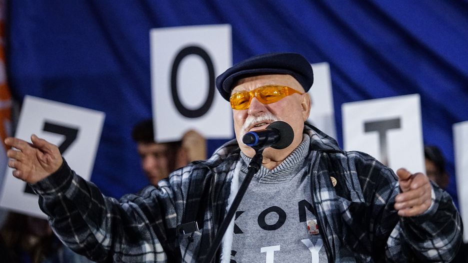 Lech Walesa speaking to the crowd with EU and Polish flags are seen in Gdansk, Poland on 10 October 2021 People take to the streets around a country to voice opposition against a ruling from the countrys Constitutional Tribunal on Thursday saying that the constitution overrides some EU laws. (Photo by Michal Fludra/NurPhoto via Getty Images)