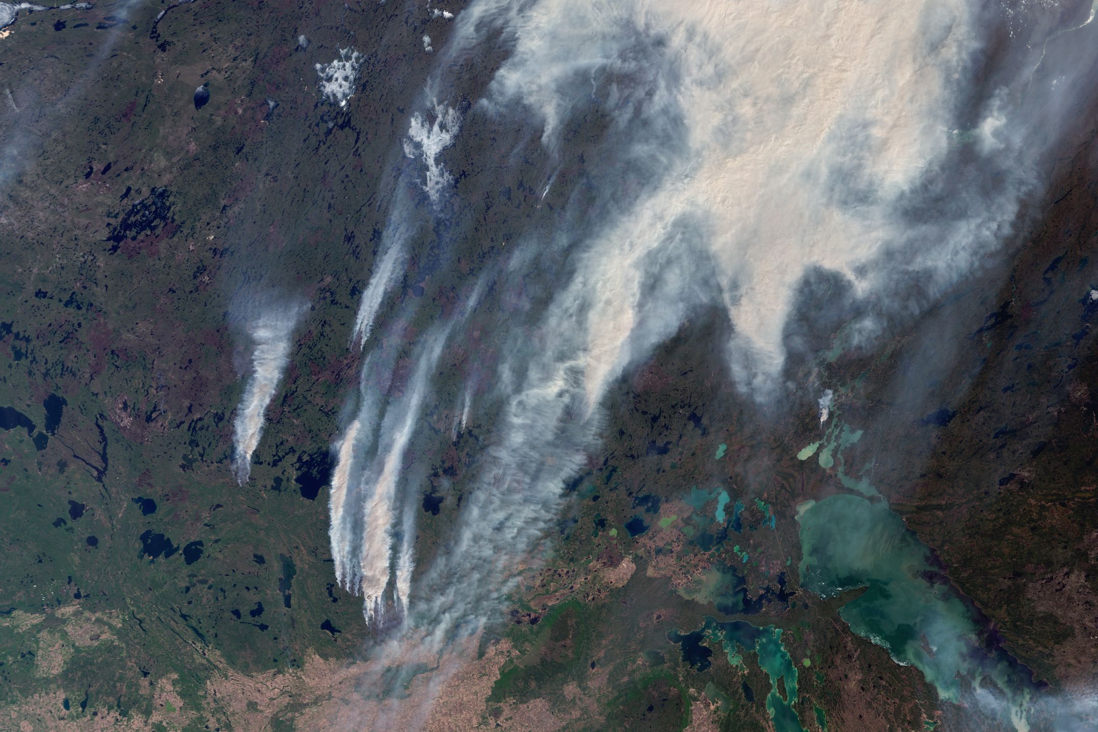 CANADA - 26 MAY 2025: Massive fires are sweeping across Saskatchewan, triggering evacuations in areas like Little Bear Lake, Whiteswan, Whelan Bay, and Piprell Lake. This satellite view captures thick smoke blanketing the region as emergency crews battle multiple blazes, highlighting the intensity of Canada's wildfire season. Imaged 26 May 2025. (Photo by Gallo Images/Orbital Horizon/Copernicus Sentinel Data 2025)