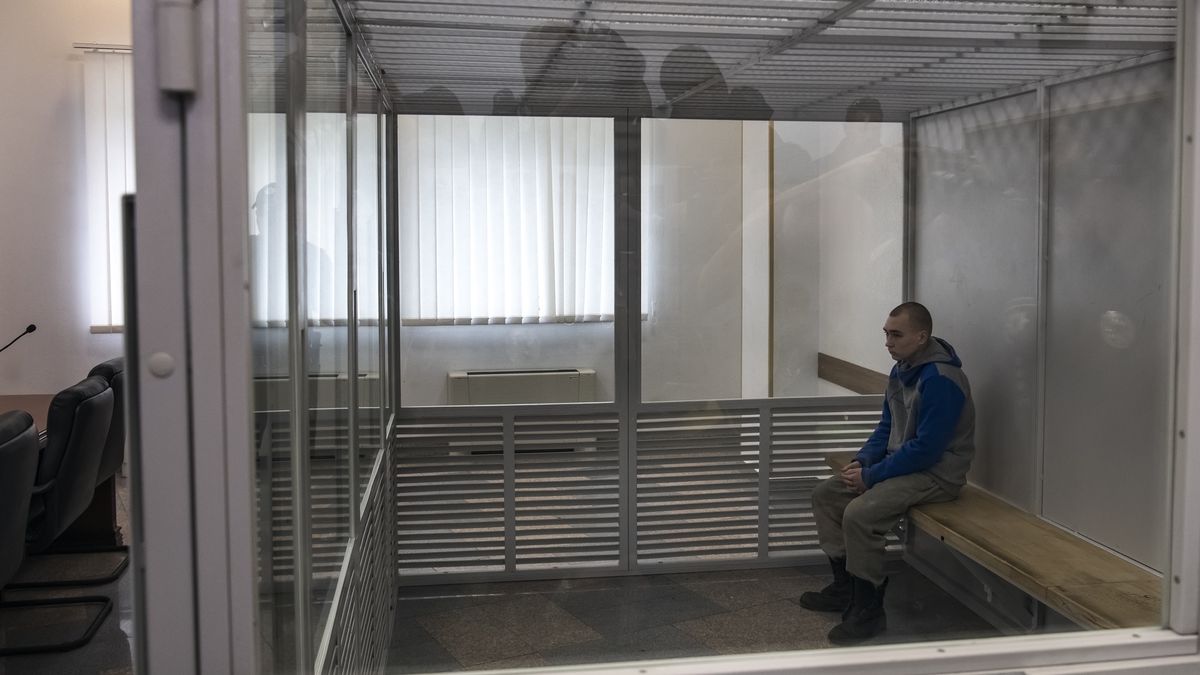 Russian soldier Vadim Shishimarin, 21, stands inside a cage after he was sentenced to life in prison by a Ukrainian court for killing an unarmed civilian in the first war crimes trial arising from Russia's Feb. 24 invasion, in Kyiv, Ukraine May 23, 2022 (Photo by Maxym Marusenko/NurPhoto via Getty Images)