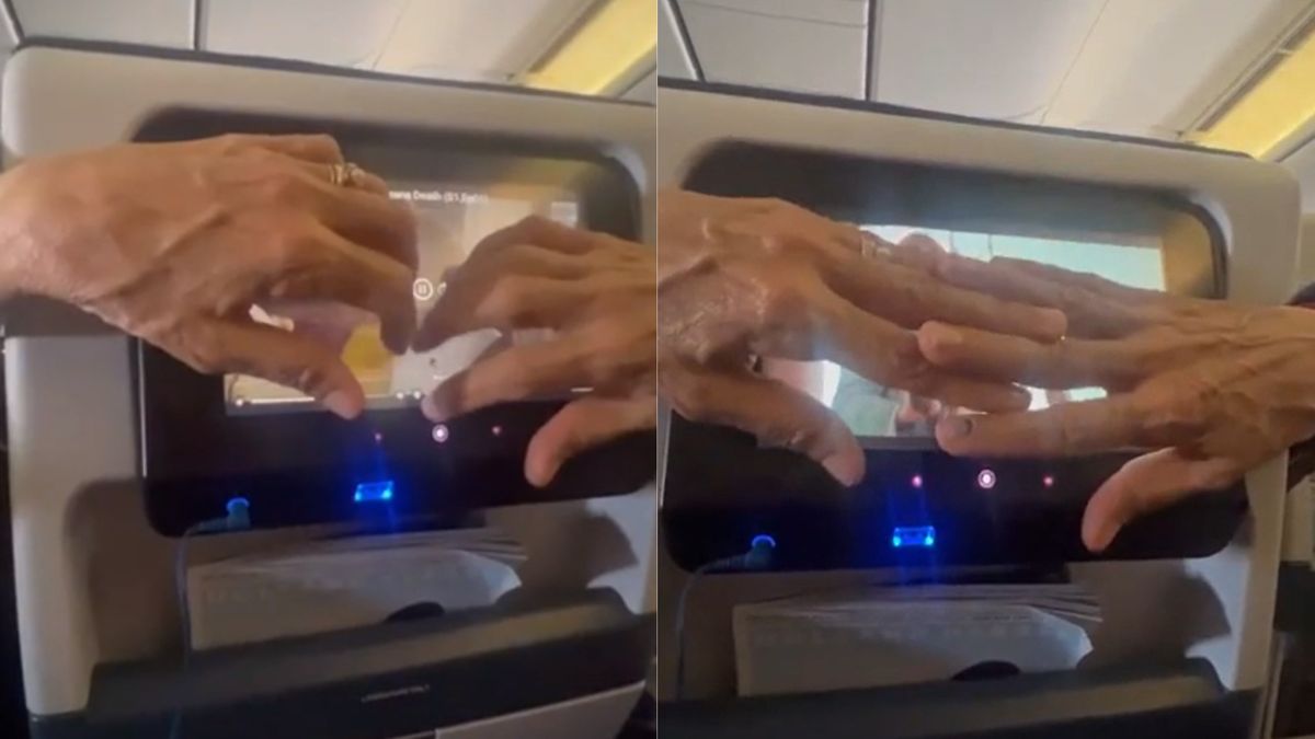 Dłonie mężczyzny zasłaniały cały ekran innego pasażera 