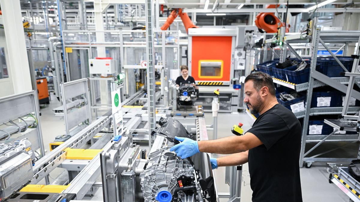 STUTTGART, GERMANY - JUNE 30: A worker assembles electric drive units for its CLA class electric vehicles at the Mercedes-Benz Untertuerkheim plant on June 30, 2025 in Stuttgart, Germany. (Photo by Florian Wiegand/Getty Images)