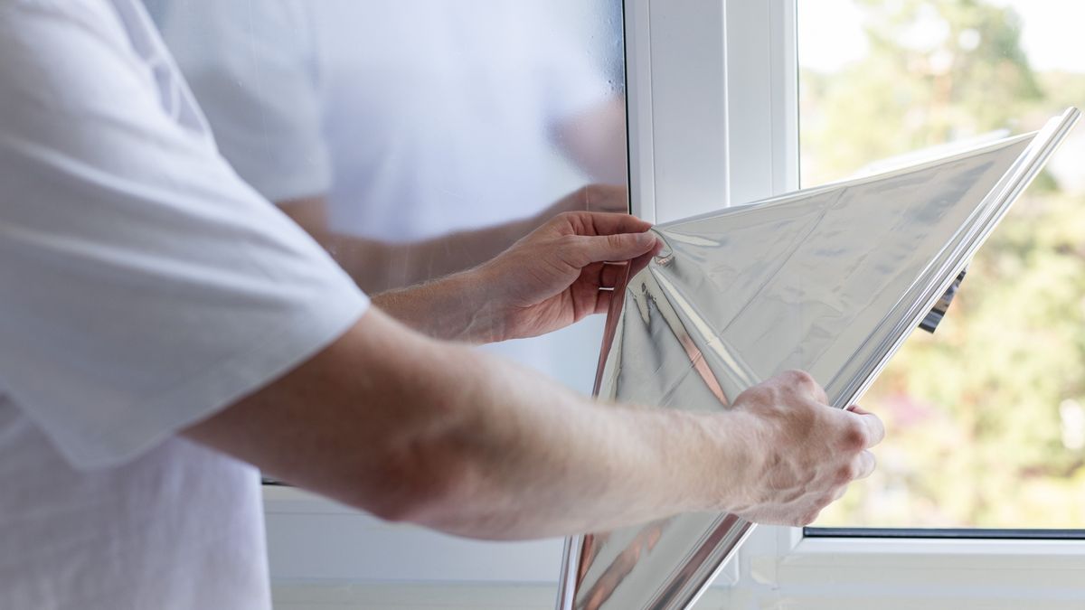 Man tinting windows at home with solar control film.
Man tinting windows at home with solar control film
Vitalina Nakonechna