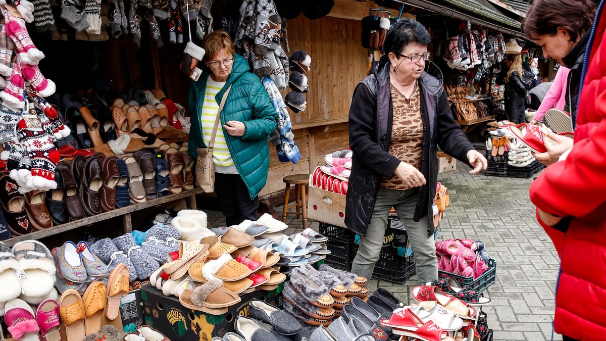 People buy winter sleepers on a landmark Krupowki Street in the center of Zakopane, a popular Tatra mountain holiday resort as Autumn cold weather starts in Southern Poland on September 17, 2024. As school holidays finished many elderly people and pensioners occupy the resort. (Photo by Dominika Zarzycka/NurPhoto via Getty Images)