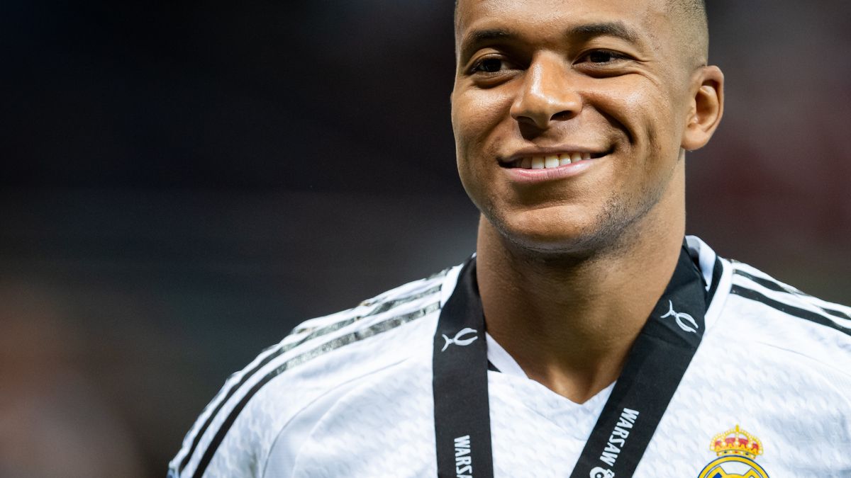 WARSAW, POLAND - AUGUST 14: Kylian Mbappe of Real Madrid looks on with Super Cup medal during the UEFA Super Cup 2024 match between Real Madrid and Atalanta BC at National Stadium on August 14, 2024 in Warsaw, Poland. (Photo by Mateusz Slodkowski/Getty Images)
