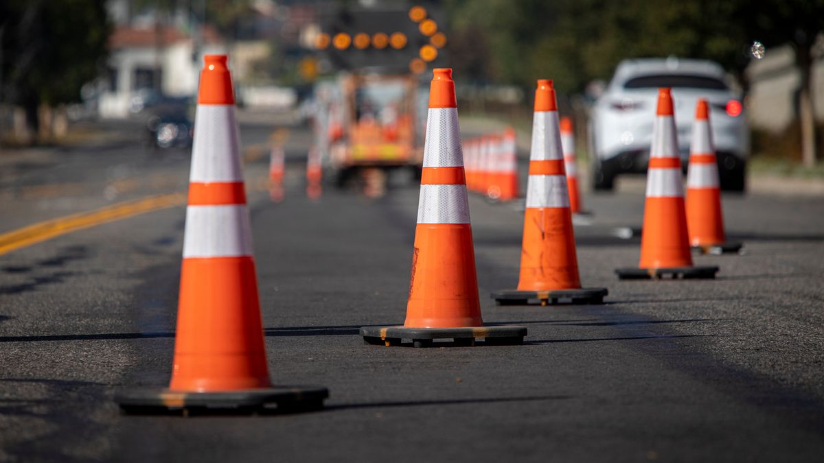 Traffic cones on road with electronic arrow pointing to the right to divert traffic and white car in distance
FRANK ARMSTRONG
arrow, beware, equipment, prohibit, hazard, delay, driving, protection, notice, symbol, repair, barricades, pylons, post, signage, highway, travel, attention, closed, work, city, urban, danger, sign, transportation, street, traffic control, safety, control, right, construction site, construction, roadwork, asphalt, car, caution, cones, divert, infrastructure, line, maintenance, orange, orange cones, organized, pointing, road, row, traffic, traffic cones, warn