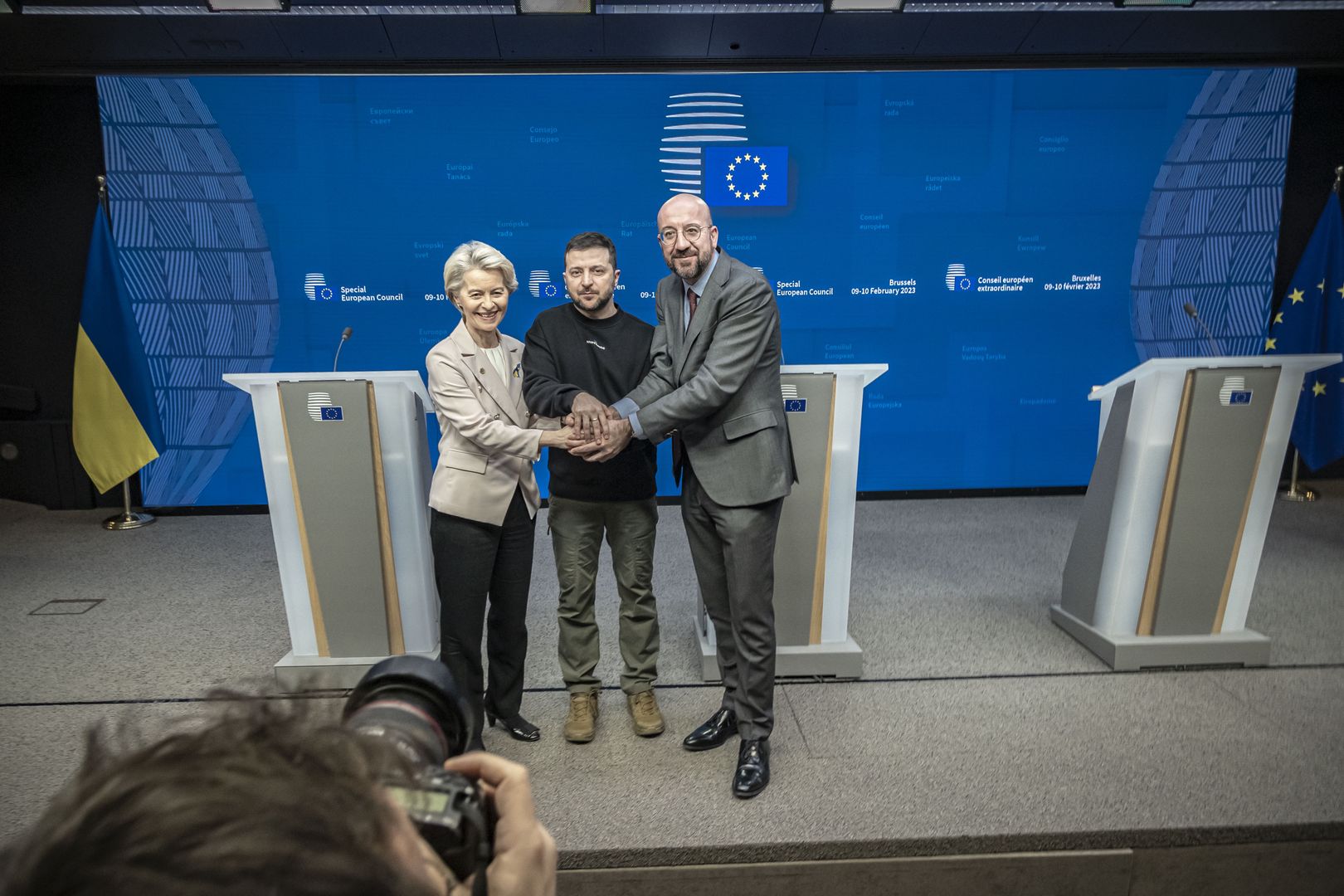 Volodymyr Oleksandrovych Zelenskyy the President of Ukraine (C) as seen with Charles Michel president of the EUCO (R) and Ursula von der Leyen President of the European Commission (L) united holding their hands together and smiling following the end of the joint press conference with statements, talking and answering questions from journalists from international media, after the meeting with the European Leaders heads of states. All three of them chanted ''Slava Ukraini'' translated as Glory to Ukraine, the national Ukrainian salute known as symbol of Ukrainian sovereignty and resistance to foreign aggression. Ukrainian President Zelenskiy attends the EU Leaders Summit, the European Council at the headquarters in Brussels. Zelensky pleads to the allies to deliver combat fighter jet planes to Ukraine. His presence in Brussels was followed after a short trip in London and Paris. Brussels,  Belgium on February 9, 2023 (Photo by Nicolas Economou/NurPhoto via Getty Images)
