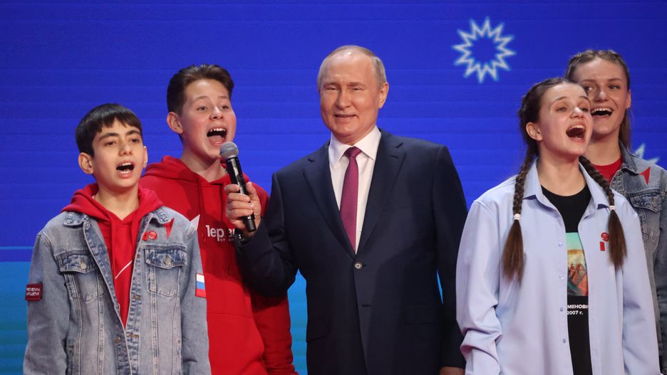 MOSCOW, RUSSIA - FEBRUARY 1 (RUSSIA OUT) Russian President Vladimir Putin (C) sings the national anthem together with participants during the 2nd Congress of the Movement of the First on February 1, 2024 in Moscow, Russia. President Putin visited the congress event , hosted by Kremlin-backed children's movement, created in 2022, inspired by traditions of Soveit-era Young Pioneer organisaton, existed in the USSR between 1922 and 1991. (Photo by Contributor/Getty Images)