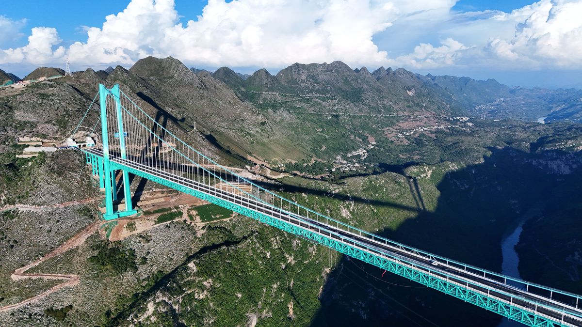 QIANXINAN, CHINA - SEPTEMBER 28: Aerial view of the Huajiang Grand Canyon Bridge on September 28, 2025 in Qianxinan Buyei and Miao Autonomous Prefecture, Guizhou Province of China. The world's tallest bridge - Huajiang Grand Canyon Bridge opened to traffic on the morning of September 28 in southwest China's Guizhou Province, slashing travel time across a deep canyon from two hours to just two minutes after three years of construction. (Photo by Li Yunfeng/VCG via Getty Images)