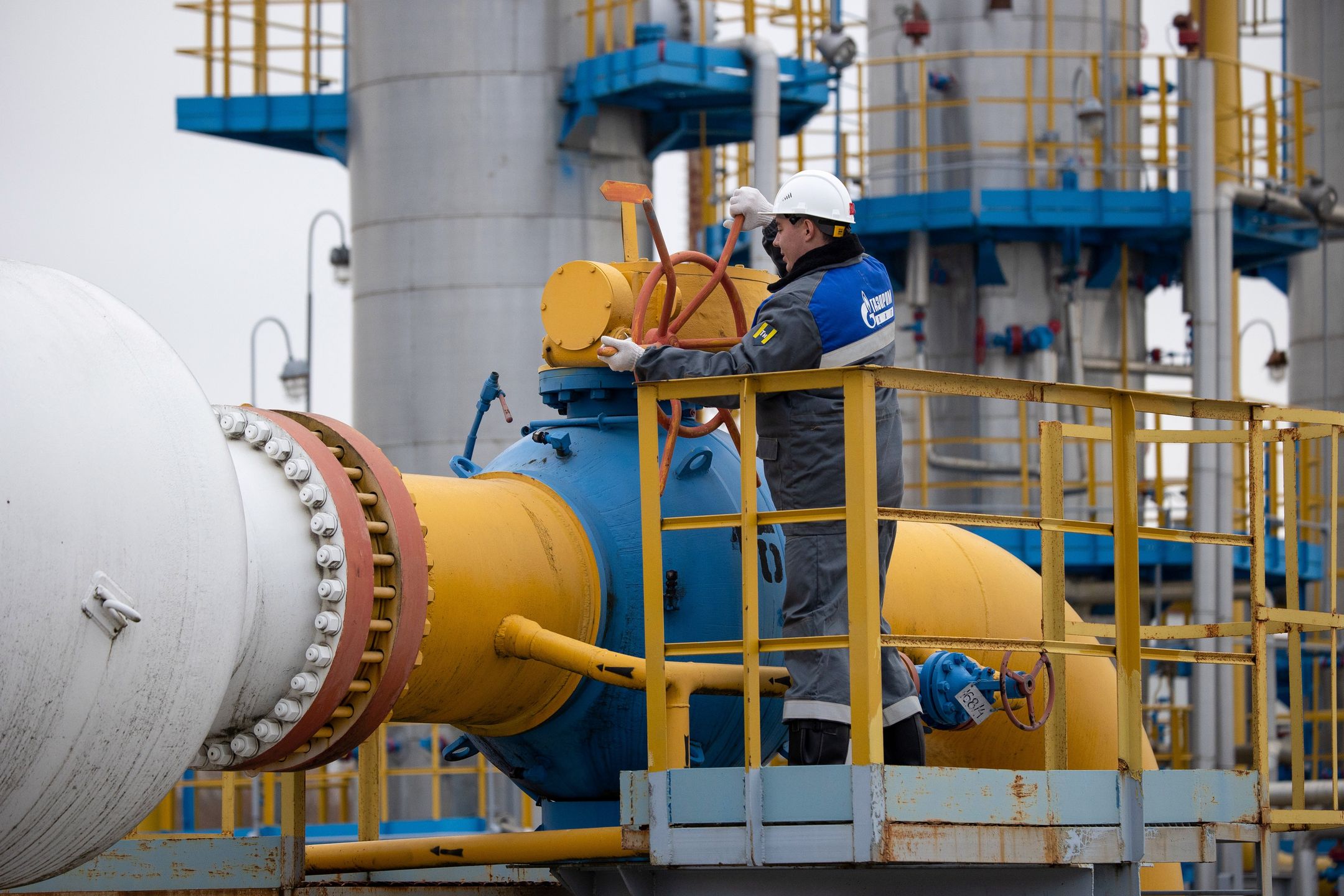 A worker turns a valve wheel at the Kasimovskoye underground gas storage facility, operated by Gazprom PJSC, in Kasimov, Russia, on Wednesday, Nov. 17, 2021. Russia signaled it has little appetite for increasing the natural gas it transits through other territories to Europe as the winter heating season gets underway. Photographer: Andrey Rudakov/Bloomberg via Getty Images