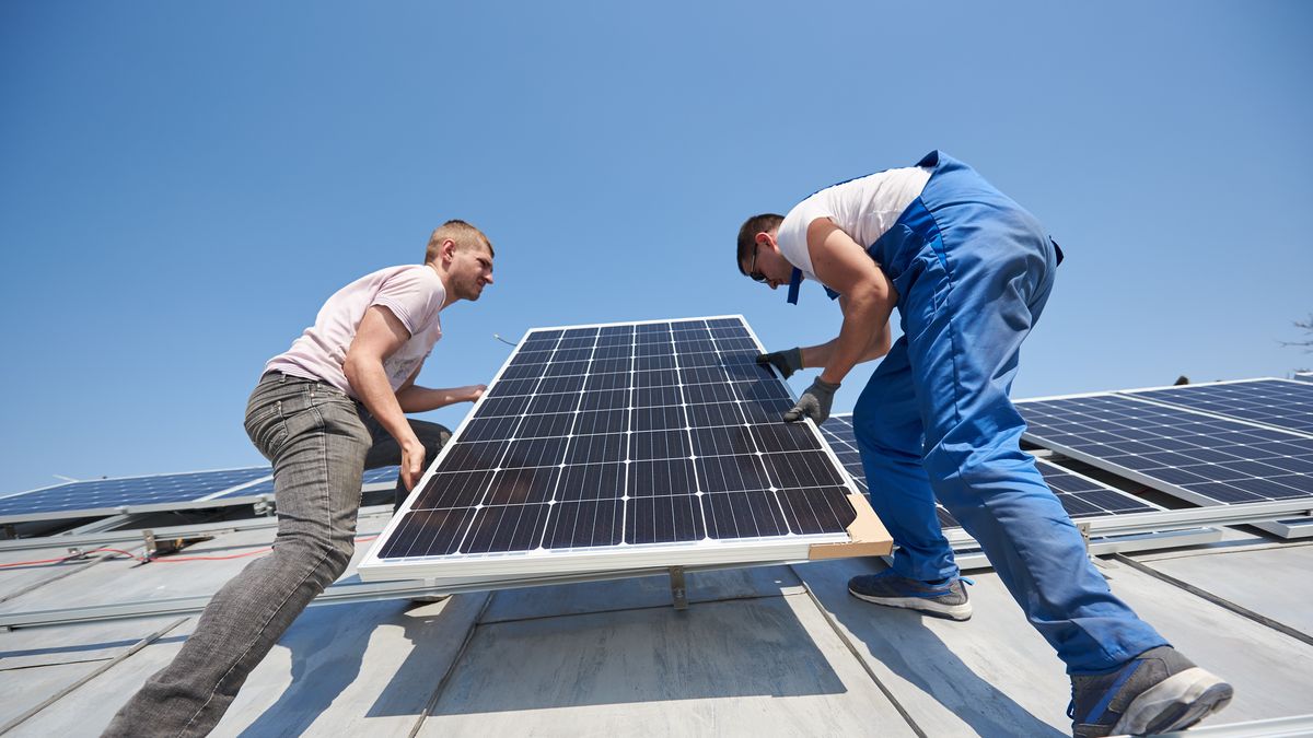 Installing solar photovoltaic panel system on roof of houseMale workers installing solar photovoltaic panel system. Electricians lifting blue solar module on roof of modern house. Alternative energy renewable concept.Anatoliy Glebsolar, panel, photovoltaic, system, electrician, engineer, worker, roof, professional, installation, mounting, home, generator, ecology, repairman, outside, man, voltage, energy, array, generation, working, construction, residential, building, renewable, maintenance, team, workplace, instrument, ecological, installer, technician, install, carry, house, grid, cells, batteries, clean, sustainability, electric, global, technology, efficiency, innovation, male, person, job, lifting