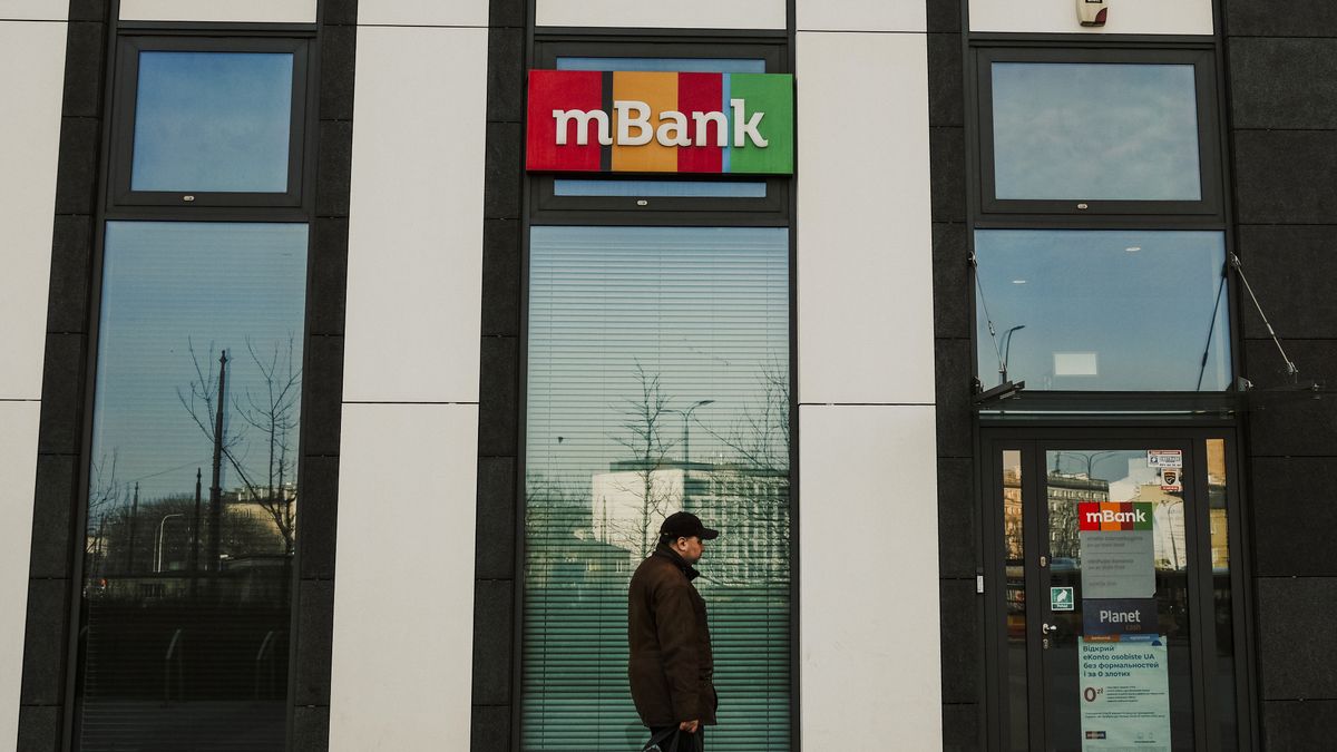A customer passes an mBank SA bank branch in the Rondo Wiatraczna shopping mall in Warsaw, Poland, on Monday, March 20, 2023. Poland's February retail sales fell 5% as prices rose 10.8% from a year earlier, data from the Central Statistical Office in Warsaw shows. Photographer: Damian Lemaski/Bloomberg via Getty Images