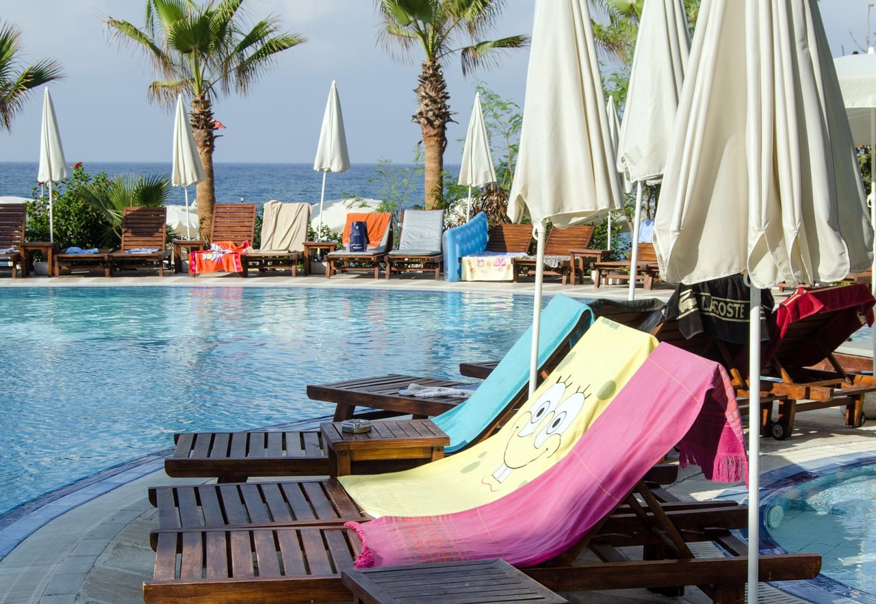 Many tourists reserve sun loungers by the pools or on the beach early in the morning.