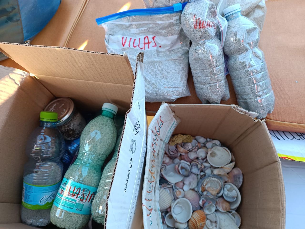 The local nature conservation guard carries sand and shells confiscated at the airport or in ports to the beach.