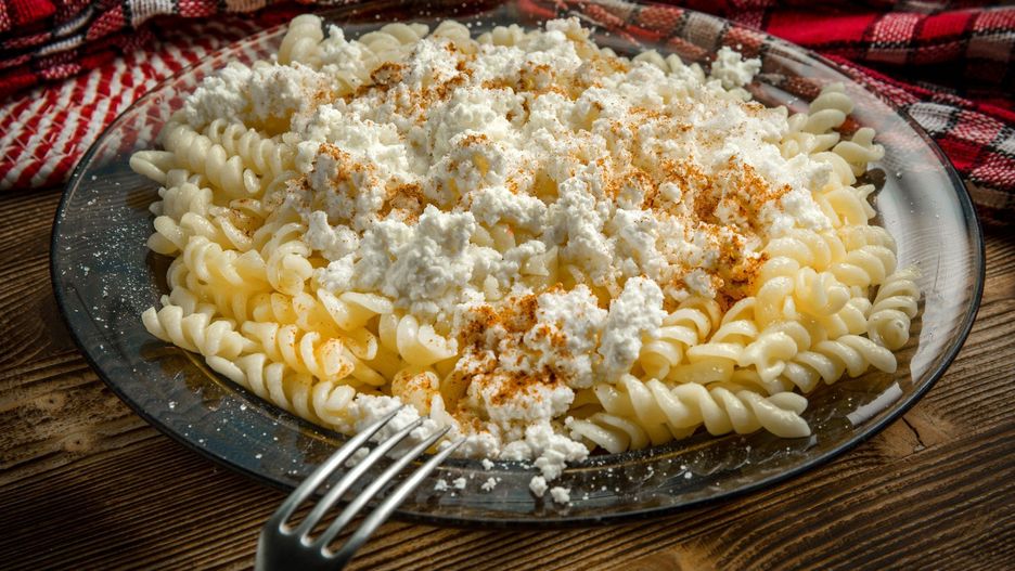 Fusilli pasta with cottage cheese, sugar and cinnamon.