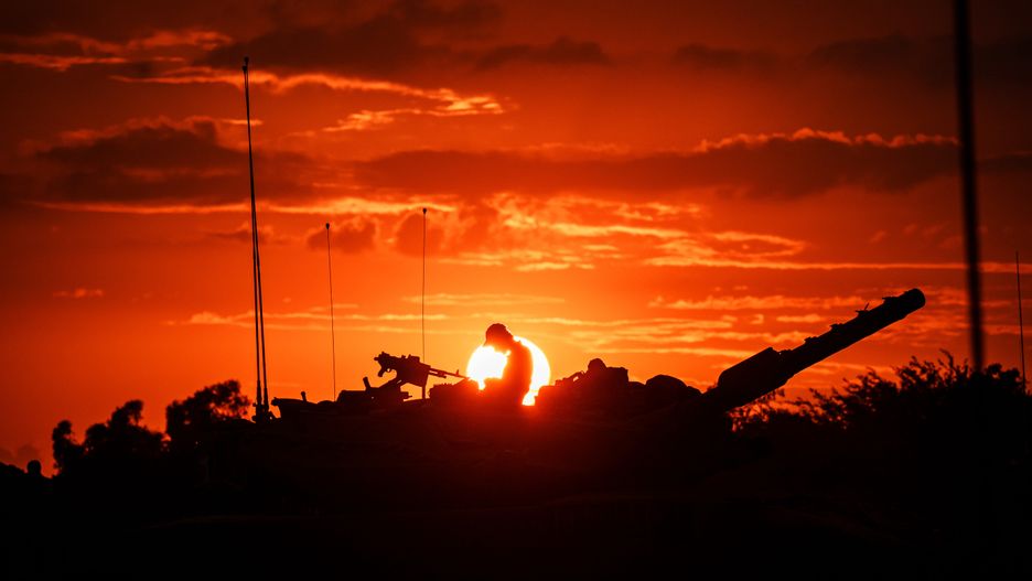 BE'ERI, ISRAEL -- OCTOBER 14, 2023: Israeli Merkava battle tank units regroup near the border of Gaza, in the southern part of Israel, Saturday, Oct. 14, 2023. Israel was caught by surprise after Hamas launched an unprecedented assault on communities near Gaza which led to the deadliest bout of violence to hit Israel in 50 years that has taken more than a thousand lives on both sides. Now, IsraelÕs military prepares for a wide scale incursion into Gaza in the countryÕs south. (MARCUS YAM / LOS ANGELES TIMES)