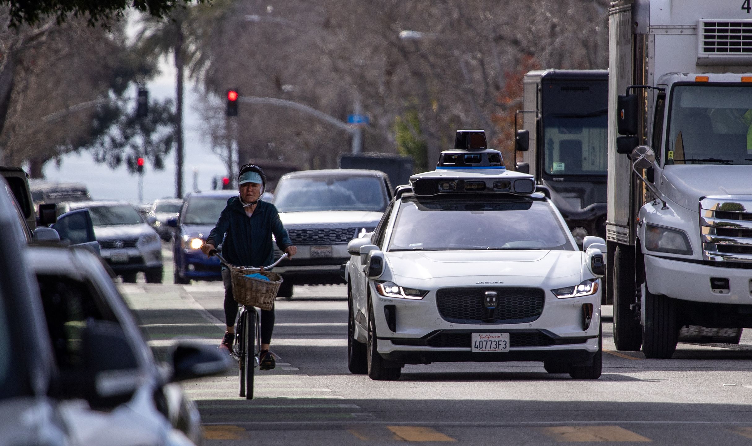 Santa Monica, CA - February 21: Passengers ride in an electric Jaguar I-Pace car outfitted with Waymo full self-driving technology in Santa Monica Tuesday, Feb. 21, 2023.  (Allen J. Schaben / Los Angeles Times via Getty Images)