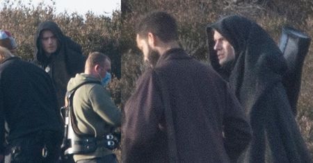 Zakapturzony Henry Cavill przechadza się po pagórkach na planie drugiego sezonu "Wiedźmina" (ZDJĘCIA)