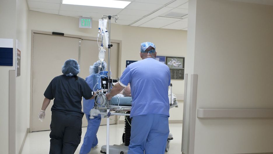 Patient being rushed through hospital corridor
Reza Estakhrian
