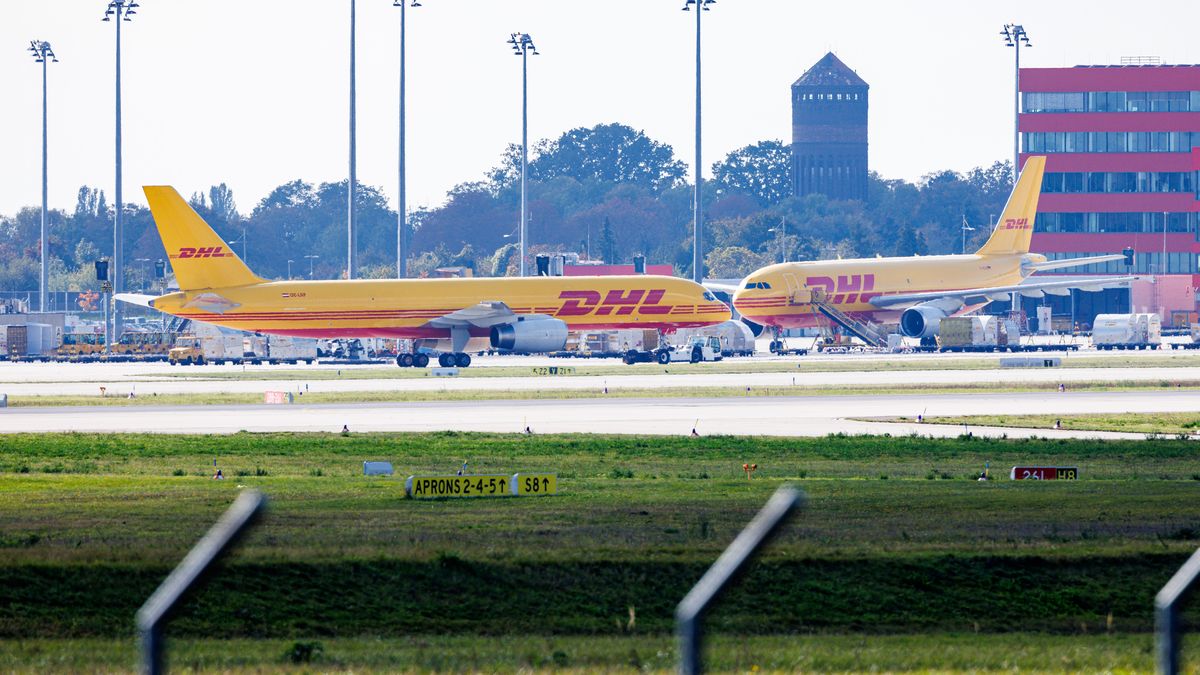 SCHKEUDITZ, GERMANY - OCTOBER 15: Two cargo airplane of the DHL package delivery company stand on the tarmac at Leipzig/Halle Airport on October 15, 2024 in Schkeuditz, Germany. Investigators suspect Russian sabotage behind the fire originating from a package at the DHL airport center last July. According to authorities, the late arrival of the package on a plane from a Baltic country resulted in the package igniting on the ground. Had it arrived on time, the package would have ignited on the outgoing flight and caused the airplane to crash. (Photo by Jens Schlueter/Getty Images)