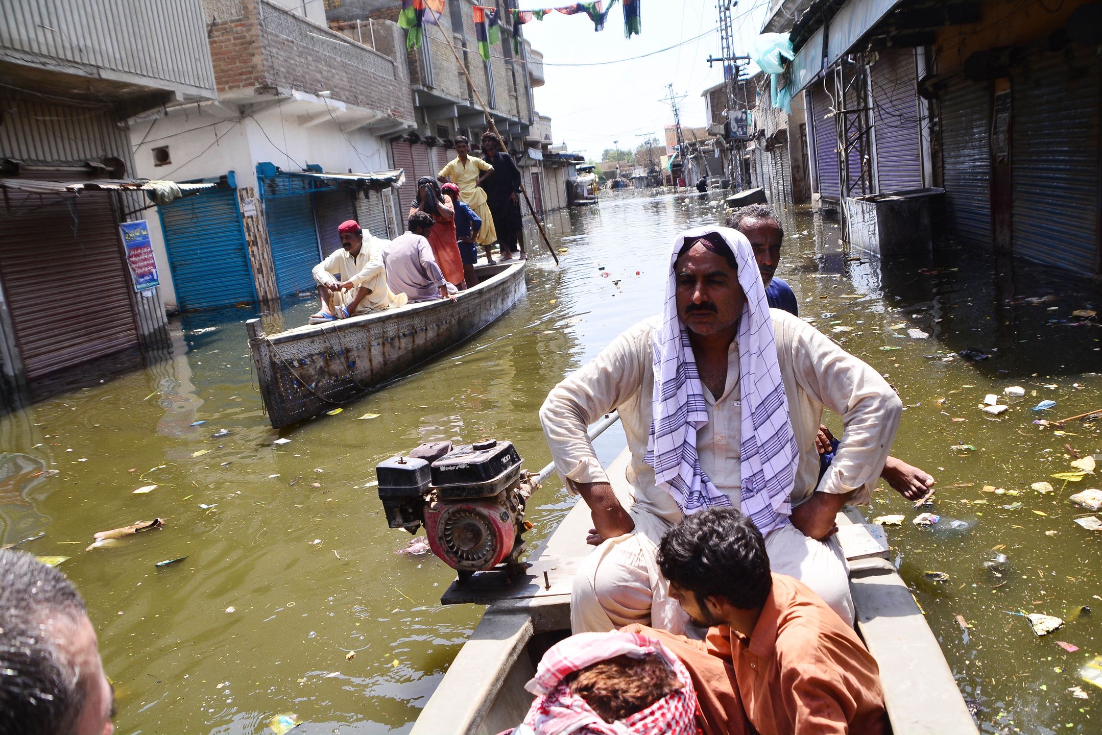 DADDU, PAKISTAN, SEPTEMBER, 07: Pakistani flood victims are being evacuated to a safer place  following flash flood in Daddu district southern Sindh province, Pakistan, on September 07, 2022. Record monsoon rains and melting glaciers in Pakistan's northern mountains have brought floods that have affected 33 million people and killed at least 1,314, including 458 children, Pakistan's National Disaster Management Agency said. (Photo by Farhan Khan/Anadolu Agency via Getty Images)