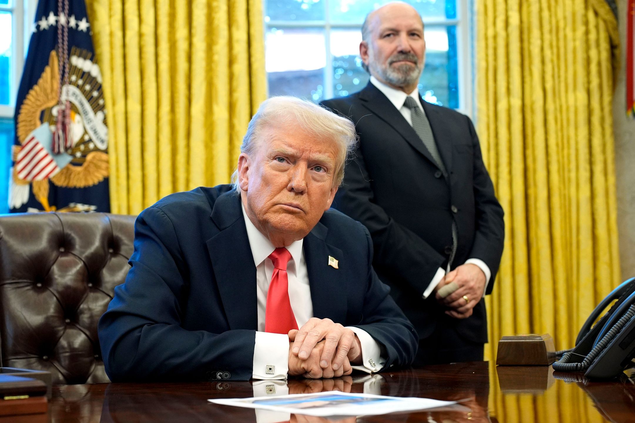 US President Donald Trump, left, and Howard Lutnick, US commerce secretary, during an executive order signing in the Oval Office of the White House in Washington, DC, US, on Tuesday, Feb. 25, 2025. Trump signed an executive action directing the Commerce Department to examine possible copper tariffs, the latest in a string of measures aimed at imposing sector-specific levies that offer to reshape global supply chains. Photographer: Yuri Gripas/Abaca/Bloomberg via Getty Images